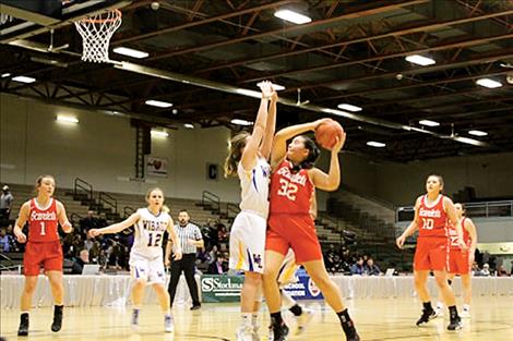 Arlee Scarlets compete during the Class C Girls State Basketball Tournament in Great Falls.