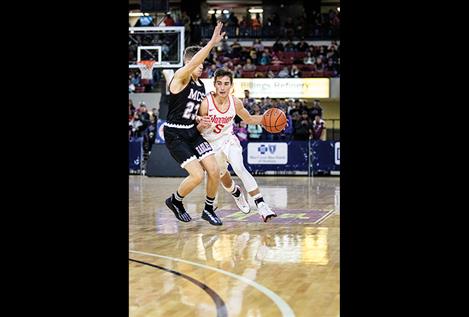 Lane Johnson moves the ball down the court.