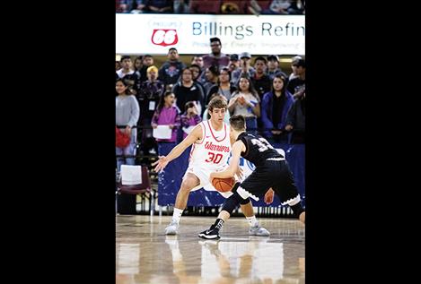 Lane Schall guards the ball.