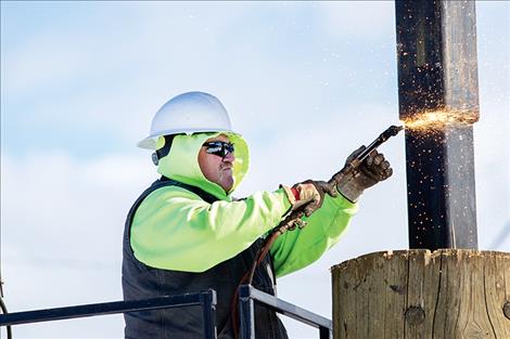  Dave Marmon cut the last steel footing on the arch.