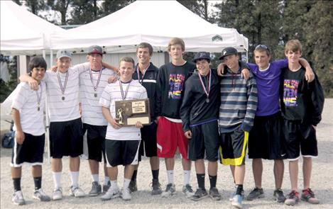 The Polson Pirate tennis players show off their plaque after winning the divisional title last weekend.