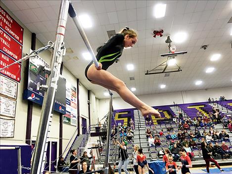 Myranda Heiser competes on the bars.