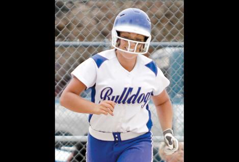 Sophomore Lindsay Johnson heads for second base with a smile.