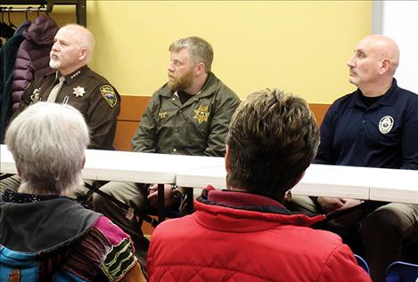 A panel of law enforcement officers, including Lake County Sheriff Don Bell, Lieutenant Levi Read, CSKT Tribal Police Chief Craige Couture and Polson Police Sgt. George Simpson, below, addressed local drug issues during the event.
