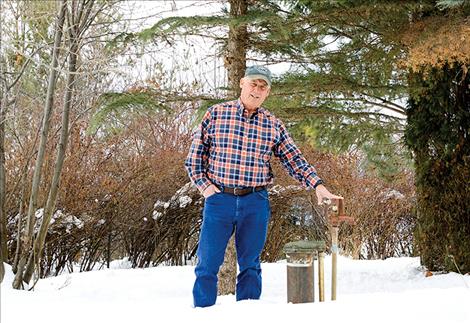 Tom Vaughn stands next to the water well on his property where high levels of arsenic were found.