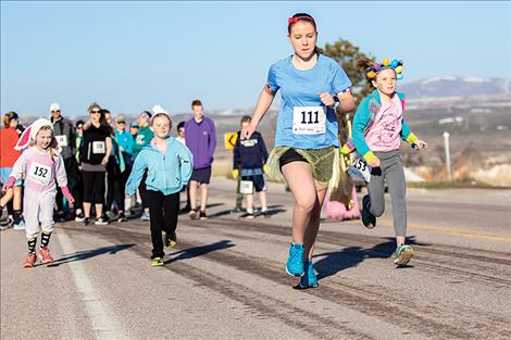 Racers take to the street at the start of the March Meltdown race.