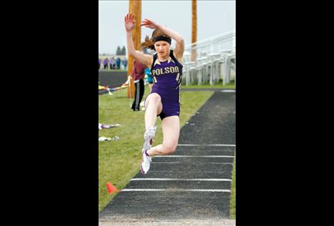 Erica Alfiero flies into the long jump.