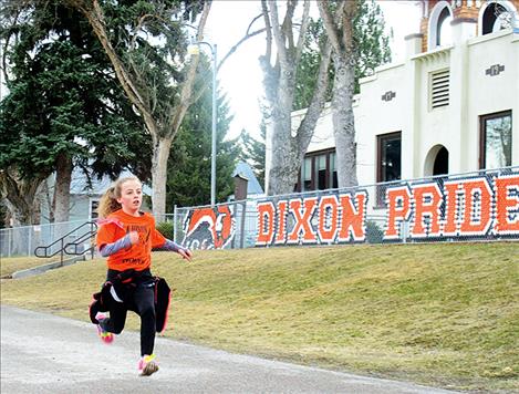 A runner races to the finish line