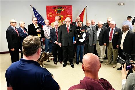 Veteran Marines at the ceremony stand together at the VFW.