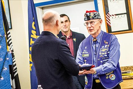 U.S. Rep. Greg Gianforte presents an American flag to Ronald “Ron” Merwin that was flown above the United States Capitol in his honor.