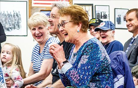 Jessie Merwin reacts to comments as her husband is honored for his service to country and community.