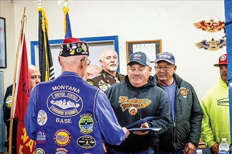 Nicole Tavenner  / Valley Journal Ronald “Ron” Merwin presents Dave Marmon of the Ronan Fire Department with a certificate of appreciation for the department's dedication in protecting the life and property of Ronan residents.