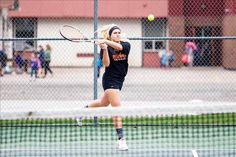 Ronan Maiden Skyler Shima returns a serve. 