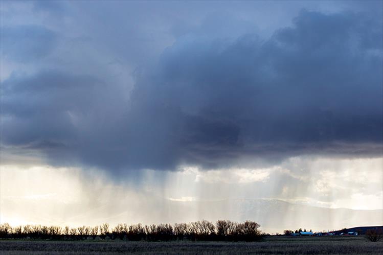 Ominous skies: April showers may bring more than flowers this year as creeks swell and fields are soaked with rain water.