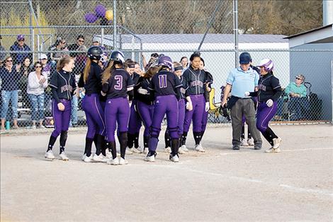 The Lady Pirates celebrate a Katelyne Druyvestein home run.