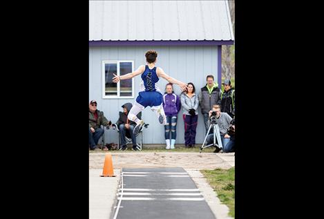 Mission Bulldog Flint McPherson flies through the air during the long jump.