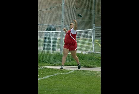 Arlee Scarlets Peyton Lammerding finishes first in the shot put and fifth in the discus. 