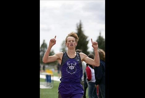 Charlo Viking Wills DeGrandpre celebrates his 1600-meter Western C Divisional title.     