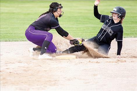 Polson Lady Pirate Savanna Carpentier makes the play at second; however, the umpire thought otherwise.