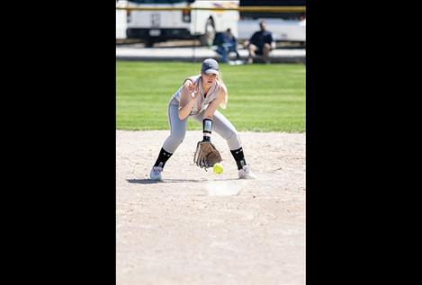 Ronan Maiden Madison Clairmont makes a play to first. Right: Polson Lady Pirate Lexi Orien makes contact for a base hit.