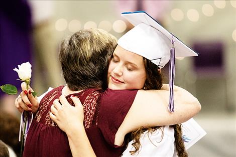 Charlo grad  Taylor Olsen gives  grandmother Olivia Olsen a big hug.