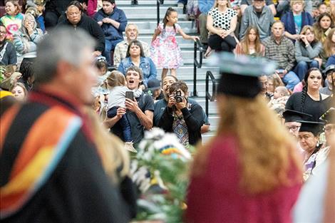 Family and friends of graduates grab some picture-perfect moments.  