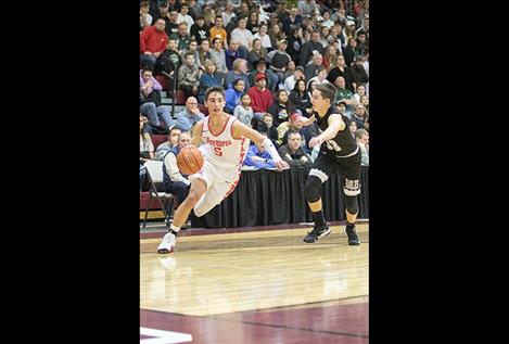 Arlee Warrior Lane Johnson races past a defender during a Class C divisional post season game.