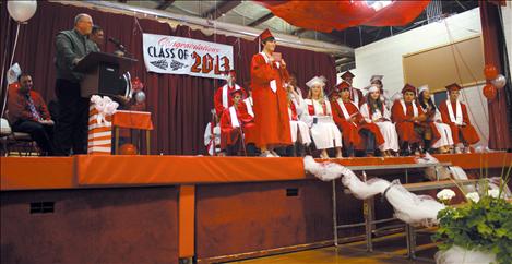 Principal Jim Taylor, left, hands out well deserved high school diplomas to Arlee High School’s graduating class of 2013.