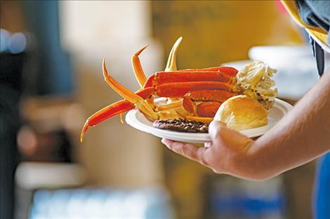 A plateful of crab makes its way to the dining area