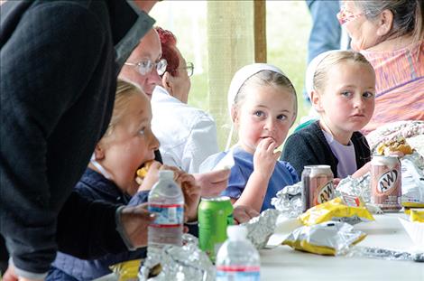 Picnic participants enjoy lunch during the auction.   