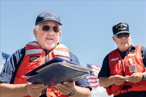 U.S. Coast Guard Auxiliary volunteer Chris Roberts and Flotilla Commander Kyle Boyce perform water vessel safety checks.