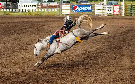  A junior bareback competitior demostrates perfect form.