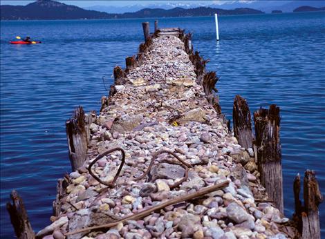 With the planks removed from the old city docks, only rocks and pilings remain, waiting for a new cover.
