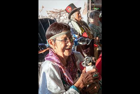  Elder Rachel Bowers holds her dog during the annual celebration.