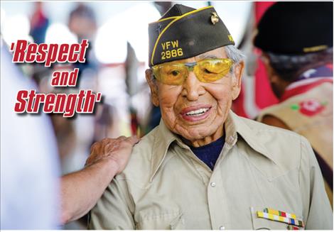 Tribal elder and World War II veteran Francis Stanger is shown respect along with other veterans during the opening ceremony of the 121st Arlee Esqapqeyni on Thursday.