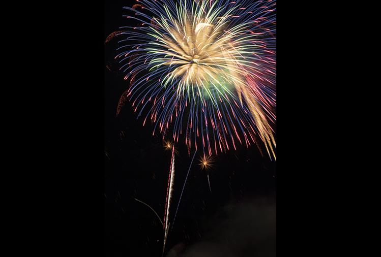 A fireworks display explodes over Riverside Park during Polson's annual Fourth of July celebration on Thursday.