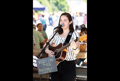 Kelsey Lyn plays music at the festival. 