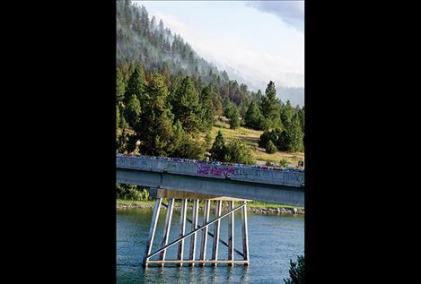 The Moss Ranch fire burns in steep, rocky terrain 14 miles southwest of Ronan.