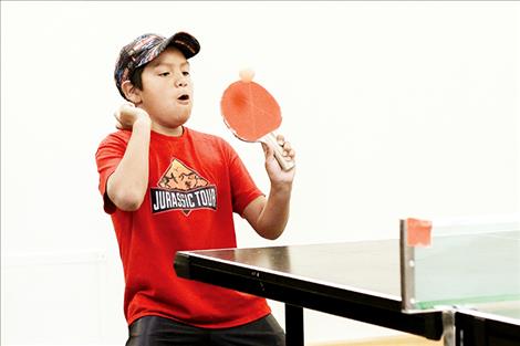 Patrick Villegas returns a volley during the inaugural valley-wide table tennis tournament hosted by Mission Valley Christian Academy.