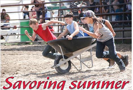 Children compete in the Pioneer Days wheelbarrow race. 