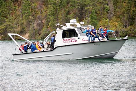 The Flathead Lake Biological Station staff give children a ride on their boat during the open house. 