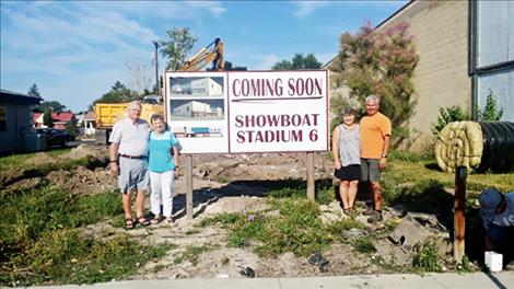 Howard and Ayron Pickerell and Becky and Gary Dupuis stand in front of the site of their family-owned theater project.