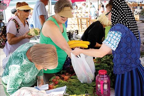 Market goers arrive early to score the freshest finds.
