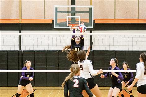 Lady Pirate Misty Tenas battles at the net on Friday during Ronan's homecoming game.
