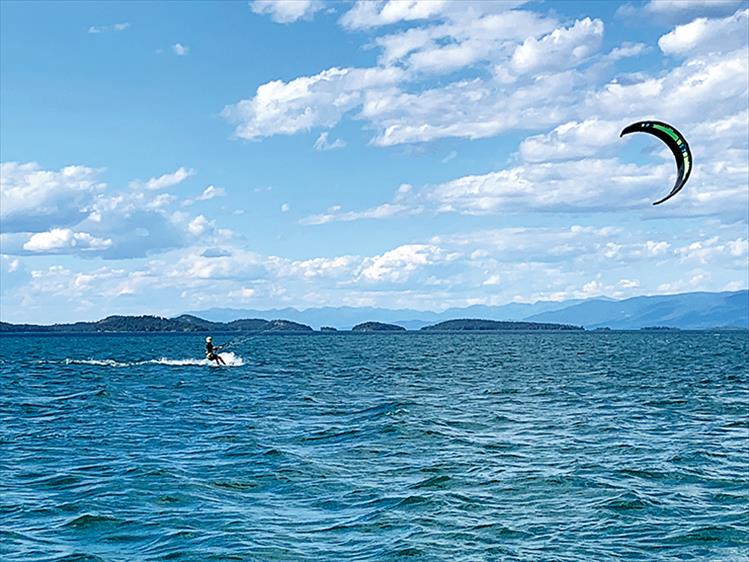 Wind and water - Windy days this summer lend ideal conditions for sail sports on Flathead Lake.