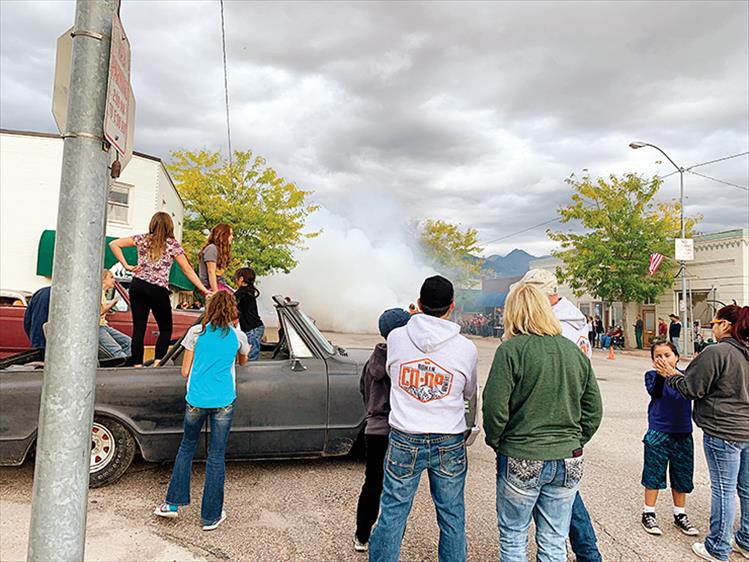 Burn, baby, burn - Local car enthusiasts burn rubber on Main Street, Ronan, during a "burn-out" following the annual Harvest Festival celebration