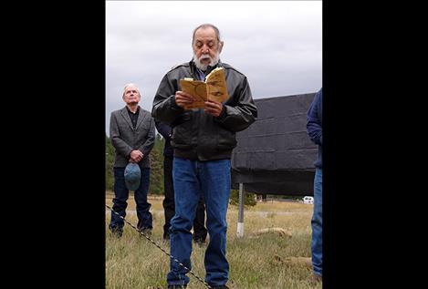 Victor  Charlo, Louis'  brother, reads a poem during the ceremony. 