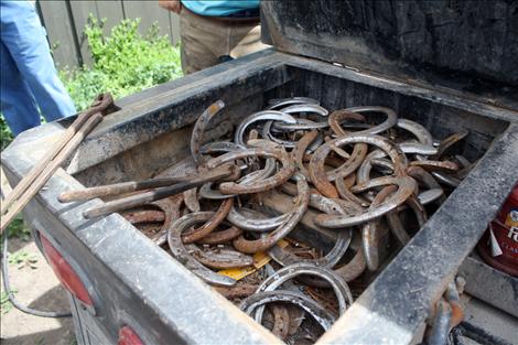 Used horse shoes rest in the bed of farrier Cam Lytle’s truck.