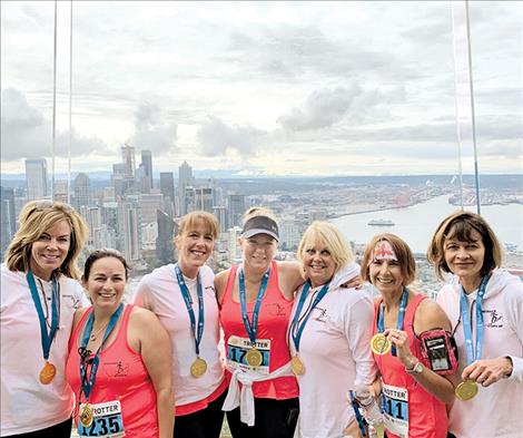 adies from the Mission Valley pose at the top of Seattle's Space Needle after climbing the 90-story iconic structure last month to benefit cancer research. 