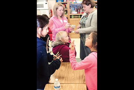 Dr. Cara Harrop, above left, participates in the wellness resource night.